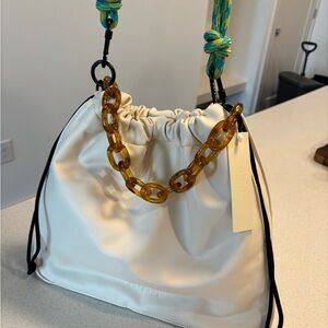 Elegant Cream Handbag with Chain Accent